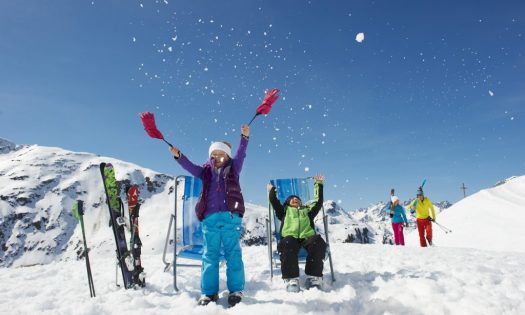 Two kids playing around in the snow in St. Anton.