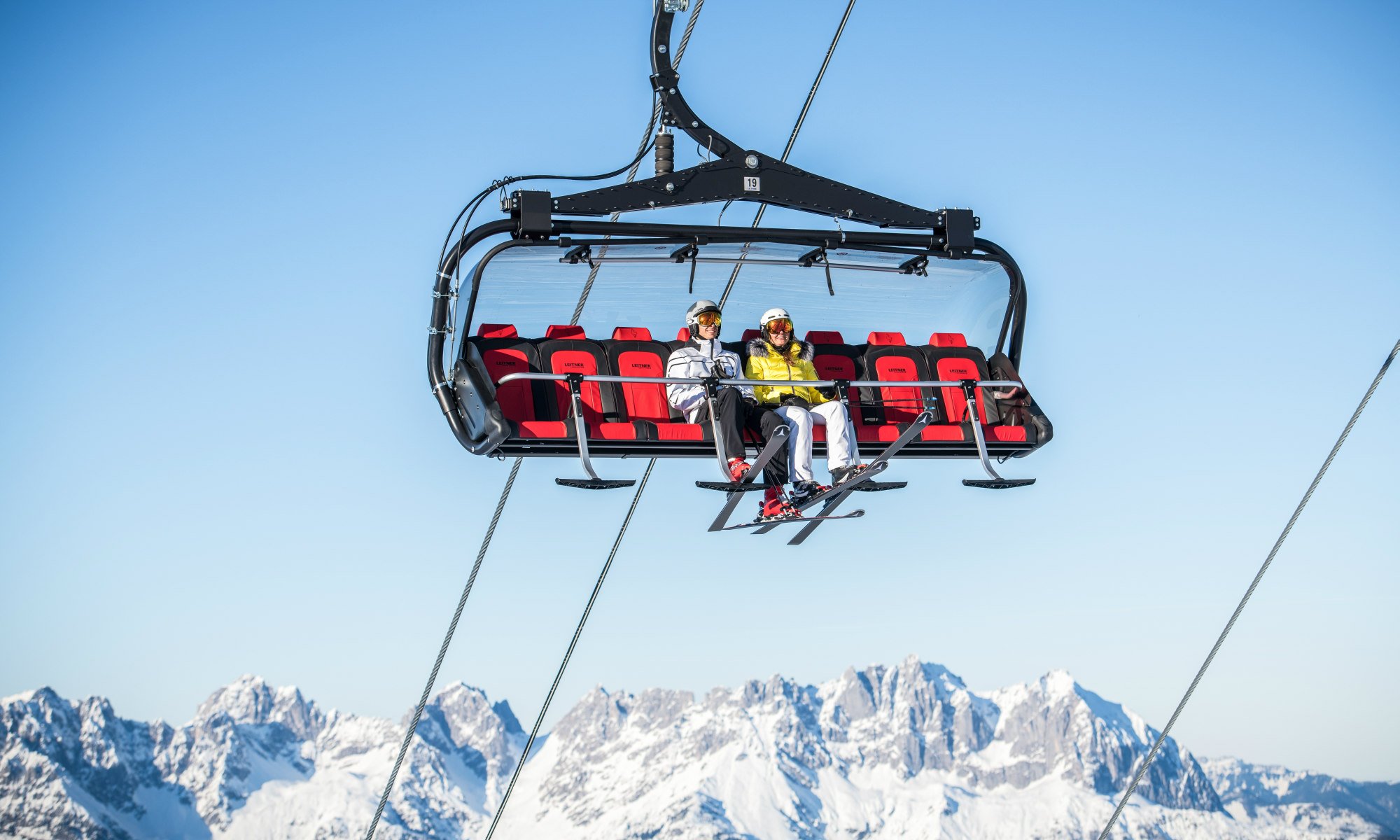 Taking the chairlift in Kitzbühel gives you the opportunity to enjoy a beautiful view of the Alps.