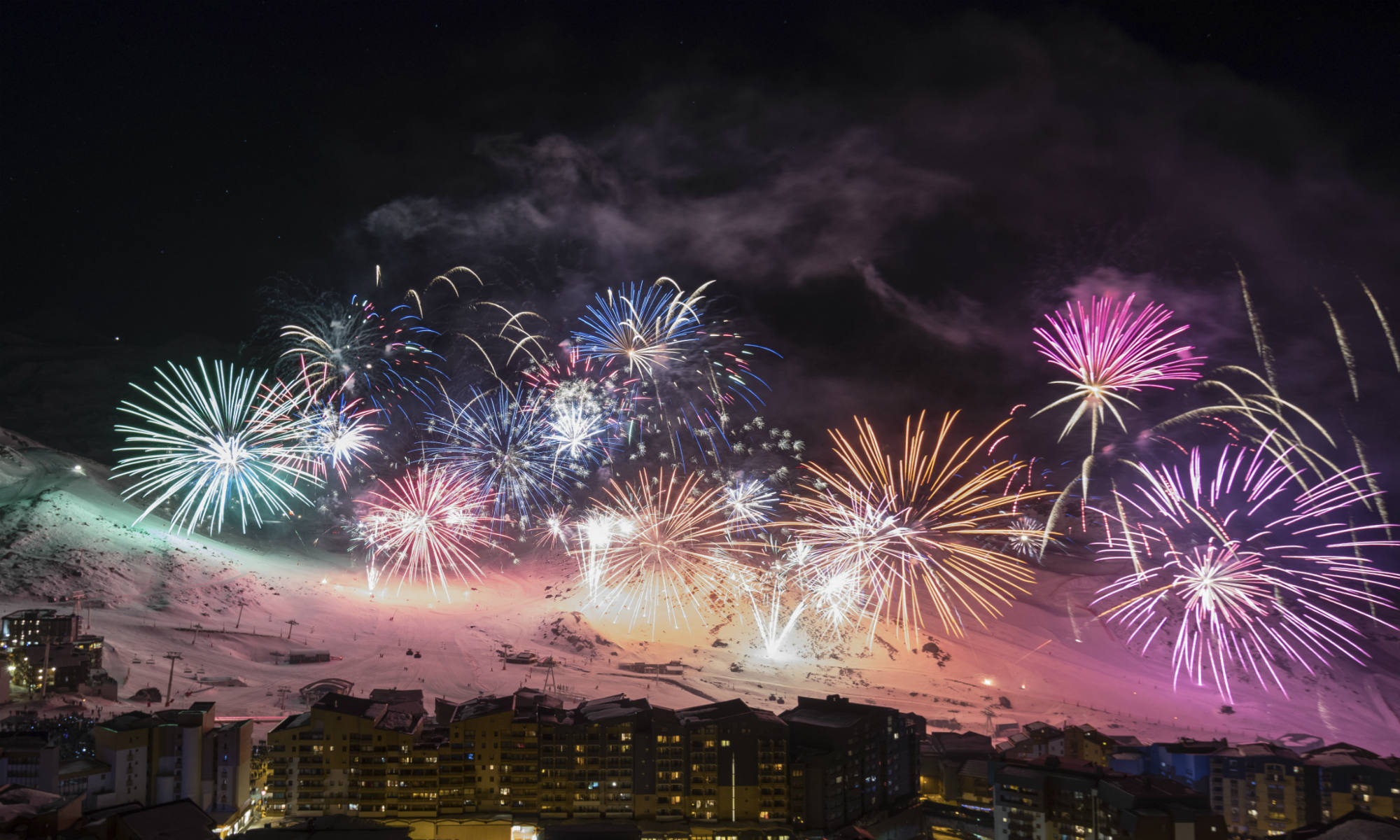 A beautiful firework show with the local mountains and the village of Val Thorens in the background.