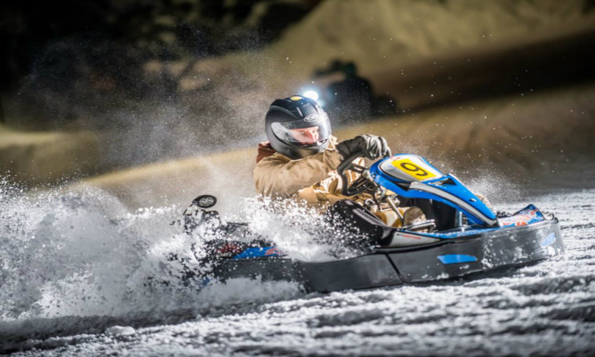 A kart pilot enjoying a snowy karting run.