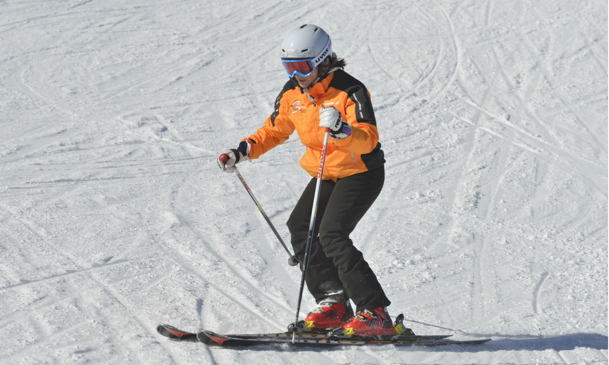 Ingrid Salvenmoser demonstrates the correct use of ski sticks when doing parallel turns on a sunny piste.