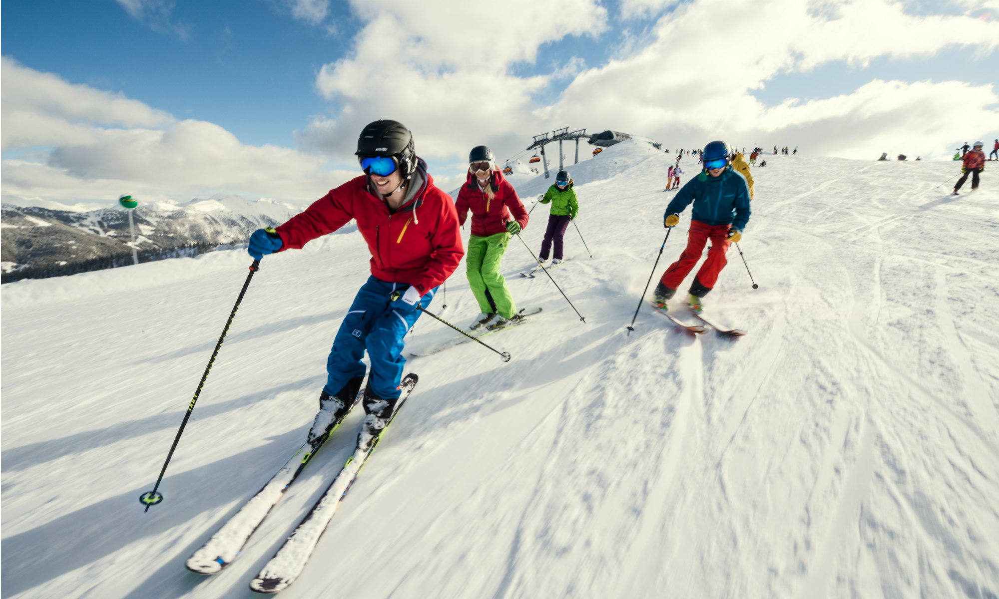 A group of skiers gliding down the slopes in Flachau.