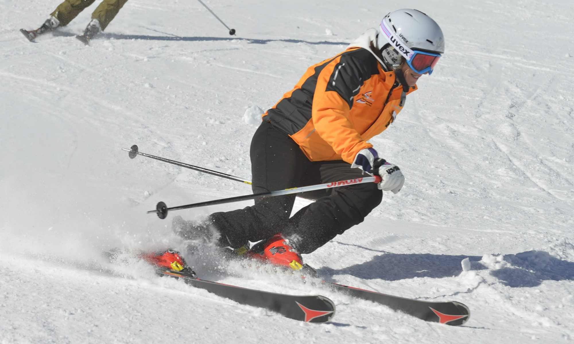 A professional skier demonstrating edging.