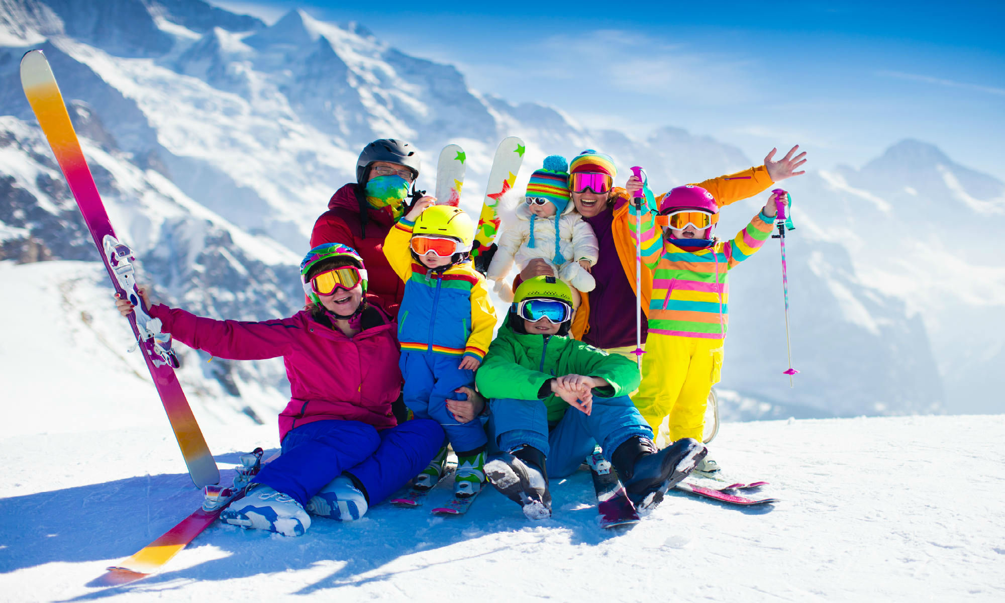 A family of skiers on a slope.