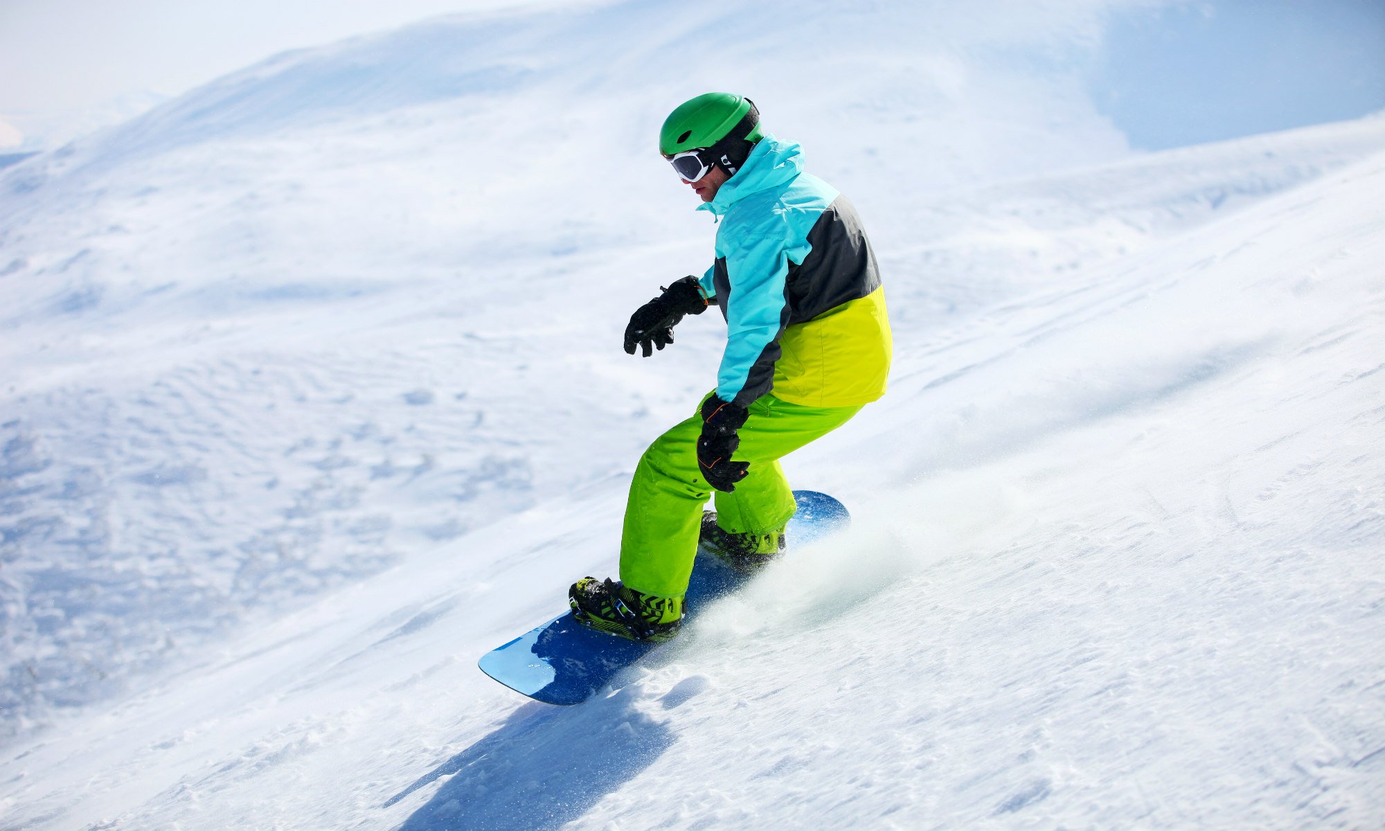 Snowboarder riding on off-piste terrain.