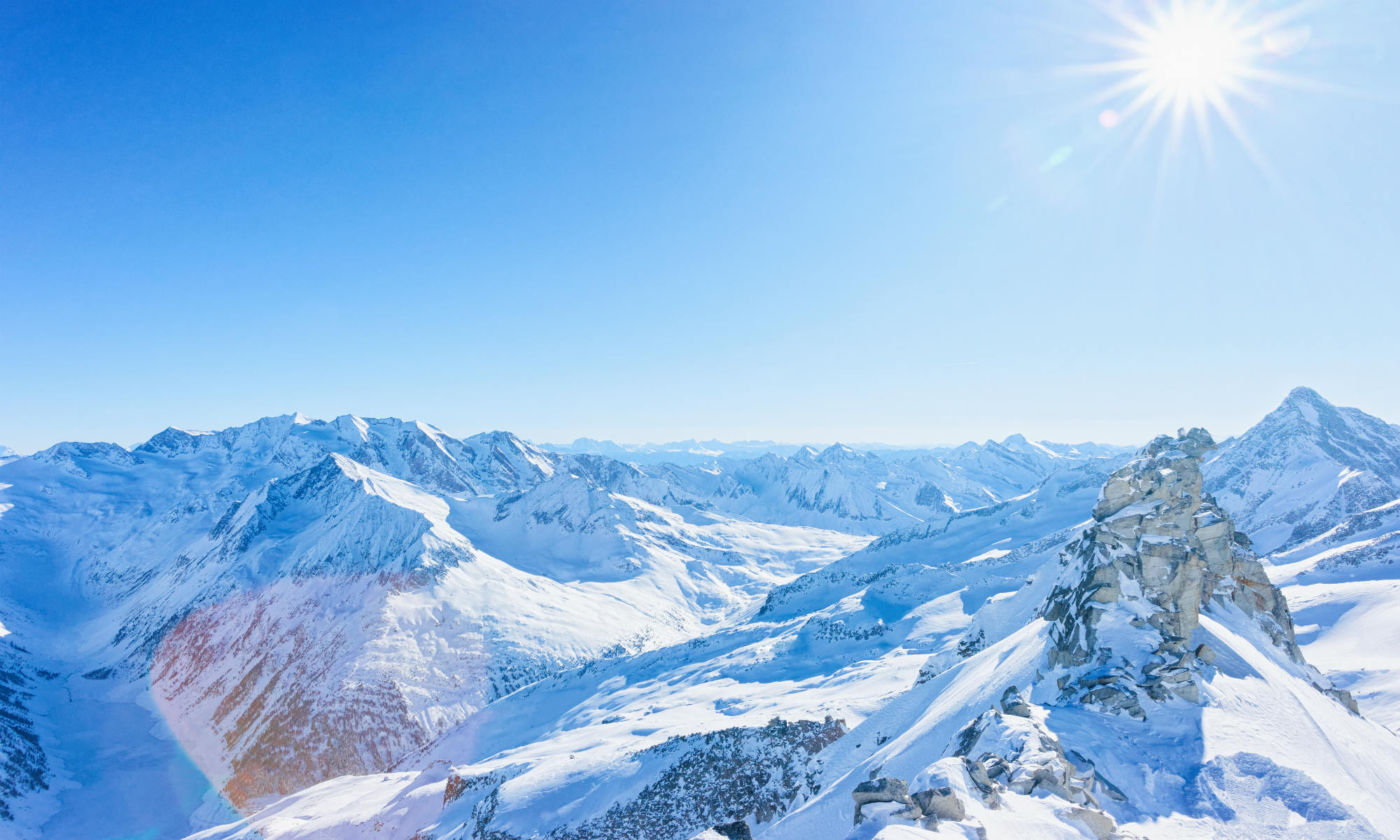 Snowy mountaintop view over the mountains by Mayrhofen.