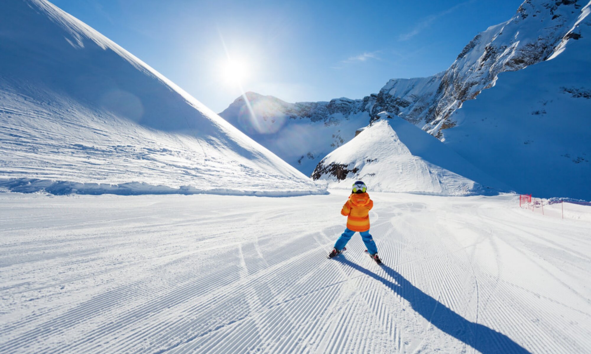 A young skier on a well-groomed beginner slope in Cortina d’Ampezzo.