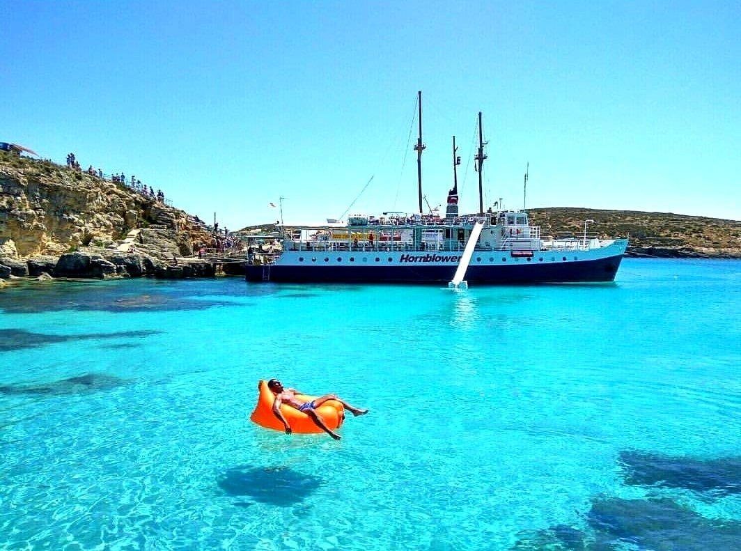 A man relaxes at the blue lagoon in Malta.