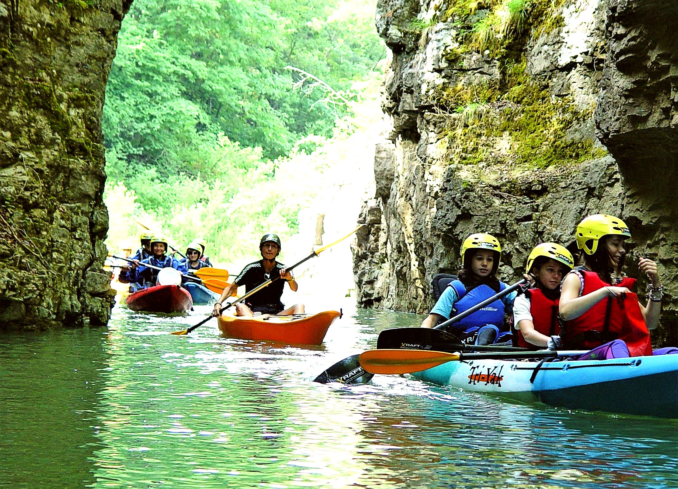 A group of kayakers explore the lake of Santa Giustina