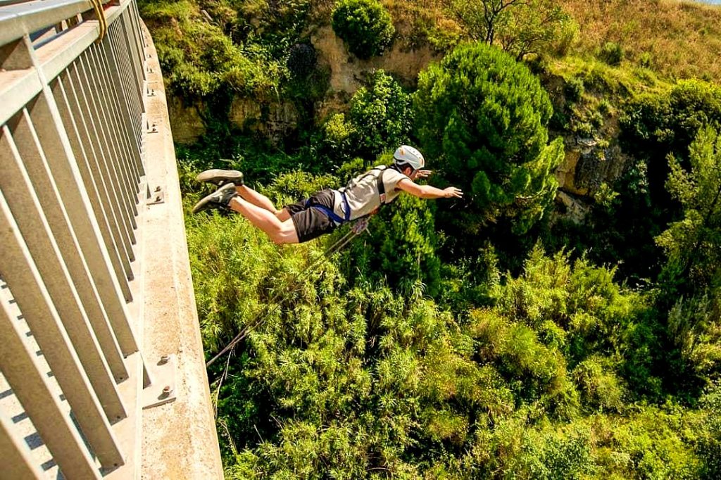 A guy feels the thrill of bungee jumping near Barcelona, a beautiful outdoor activity near Barcelona.