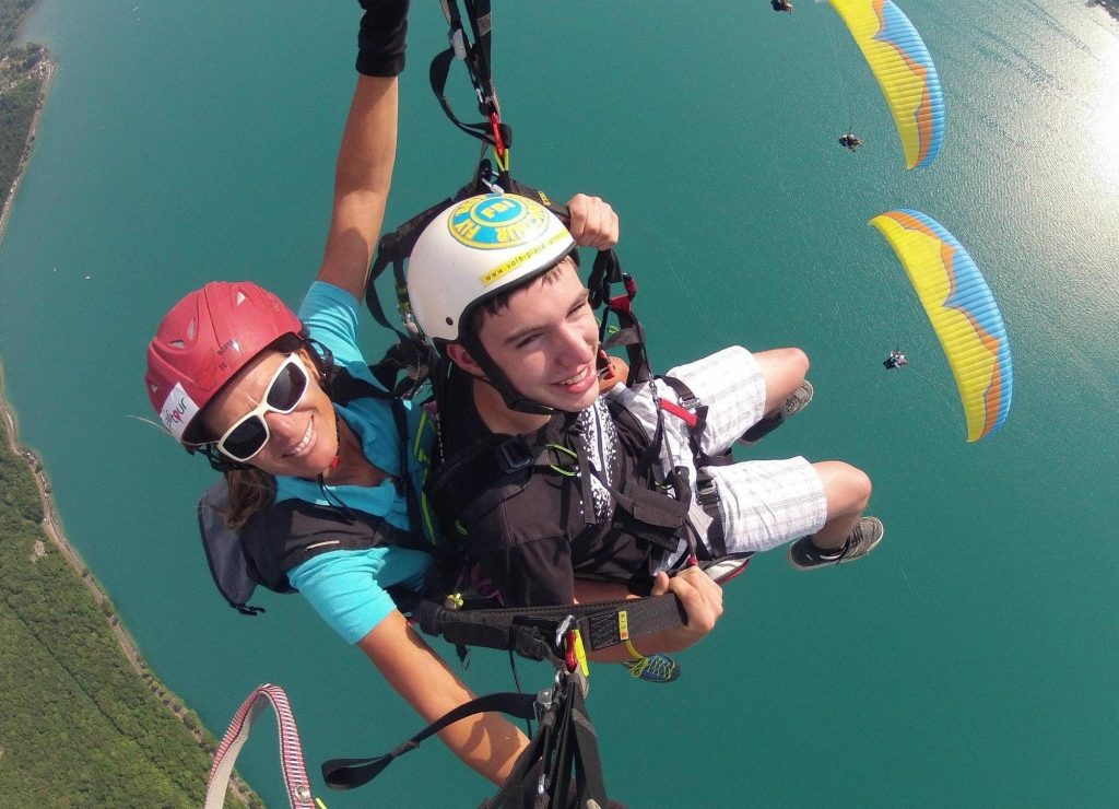 A young man on his first paragliding flight.