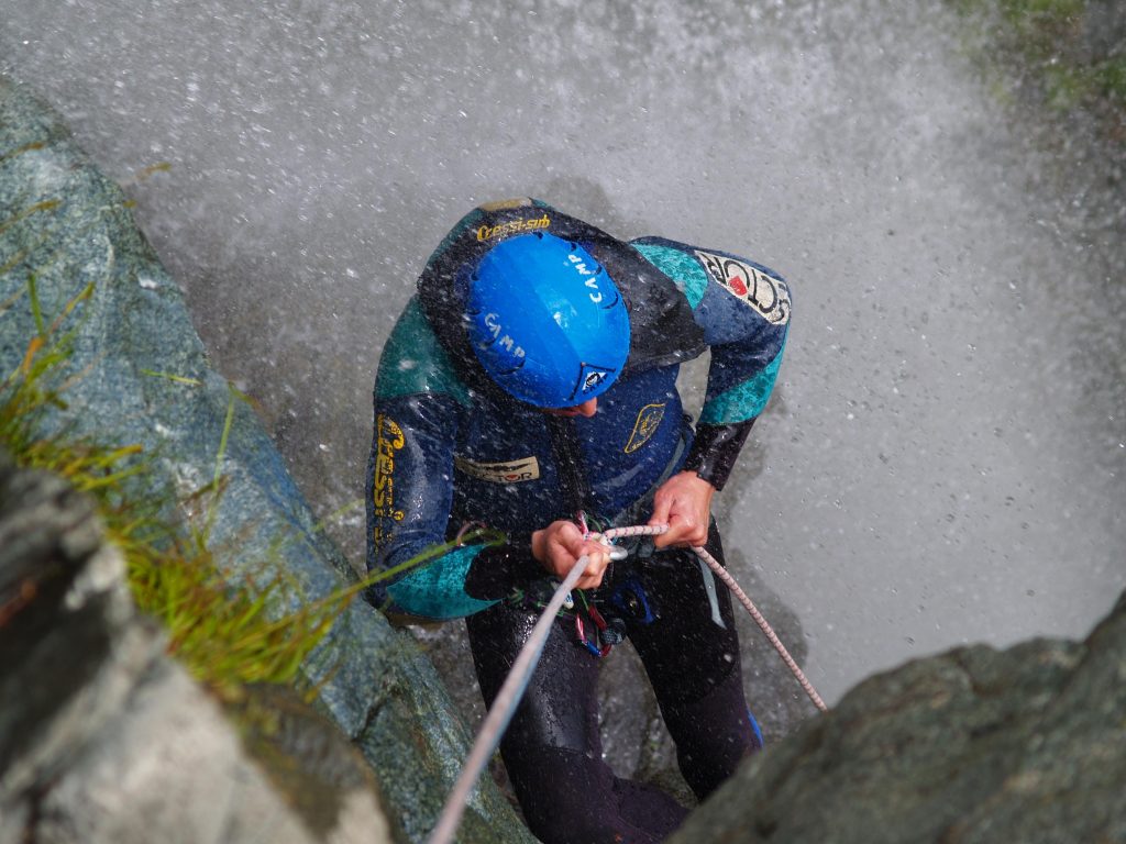 During a canyoning tour in the Chalamy, one person abseils.