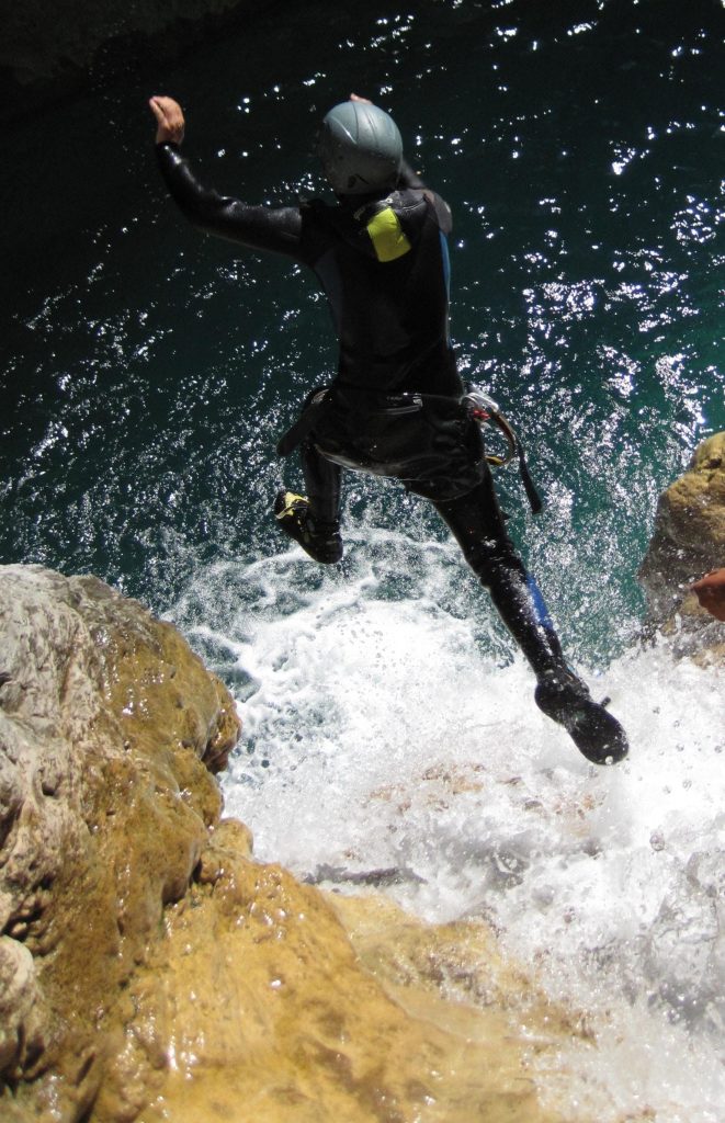 During a canyoning excursion in the Chalamy, one person jumps.