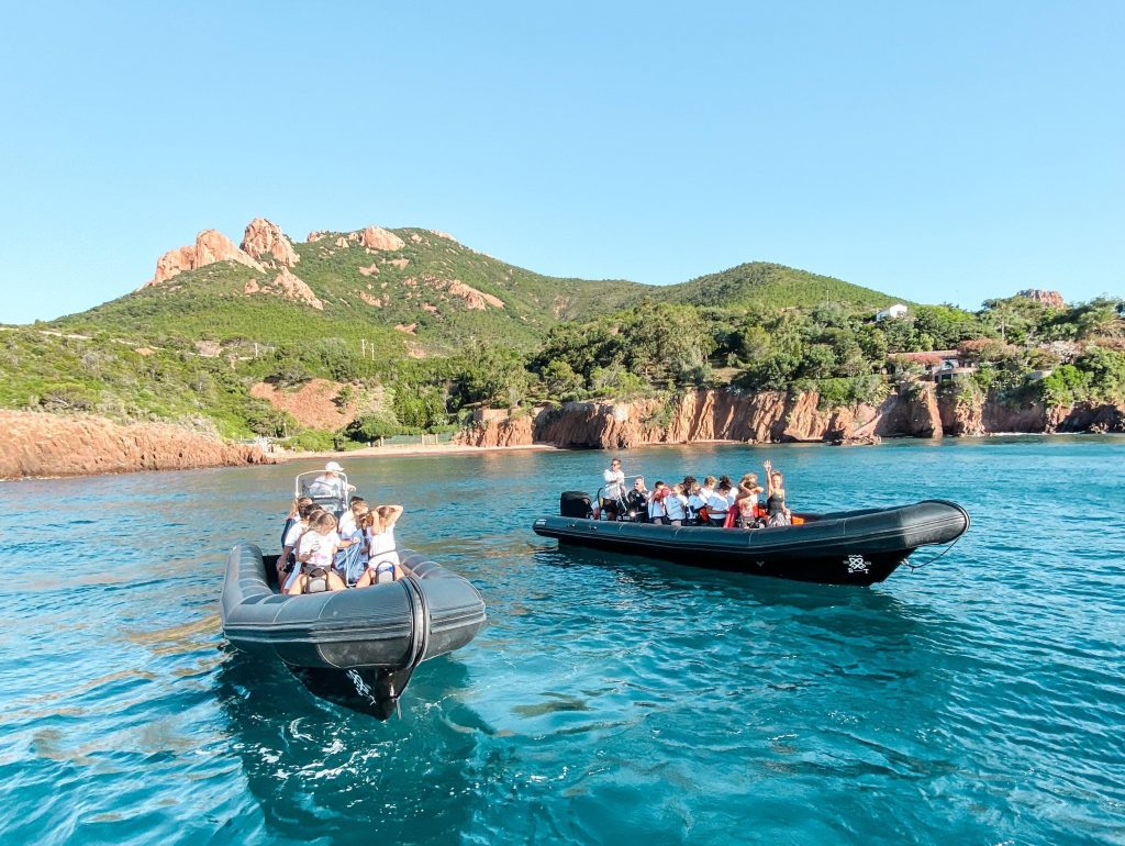 Two boats take tourists on a snorkelling excursion to Îles de Lérins.