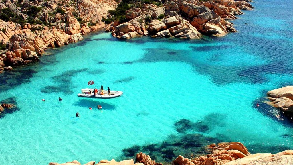 A view from the top of a snorkeling excursion in Cala Coticcio.