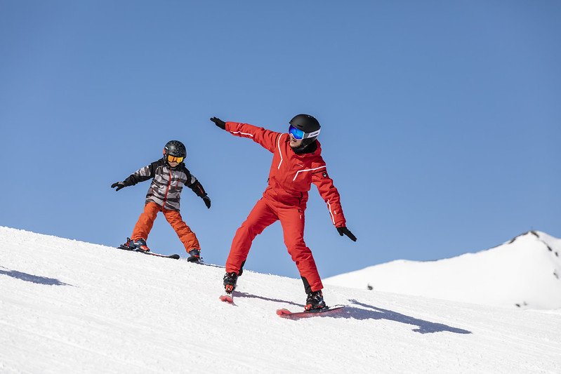 A kid is learning how to ski in Catalonia, in Spain.