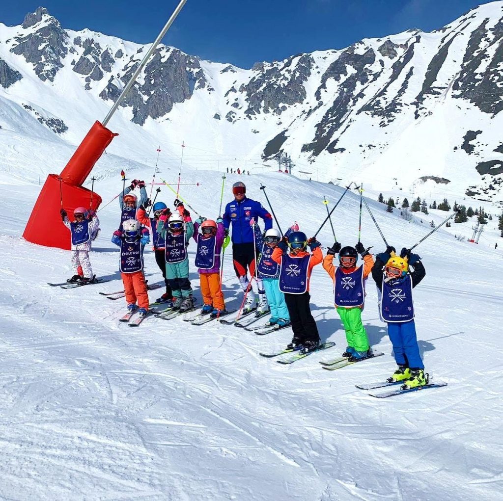 A group of children has a fun time during skiing in the 3 Valleys in Courchevel.
