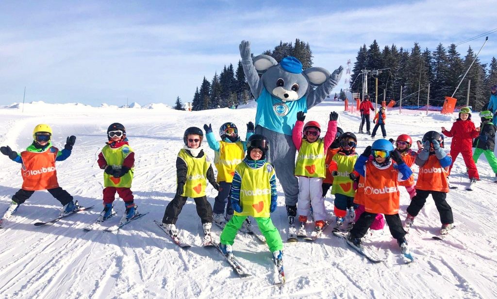 Kids are having fun while learning how to ski in France in Flaine.
