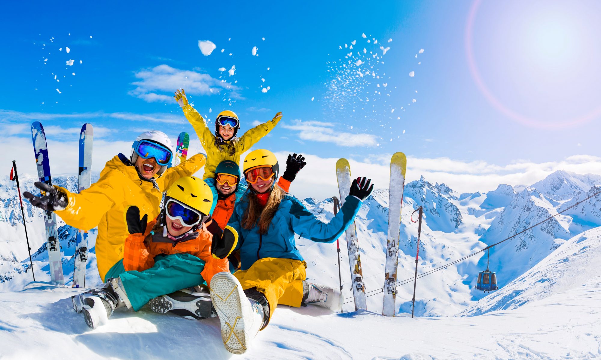 A family goes skiing during their winter holidays and take ski lessons from ski schools.