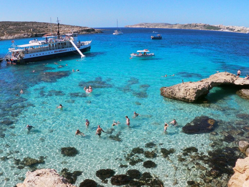 Snorkelers and divers stop at the Blue Lagoon in Comino to explore the underwater world. 