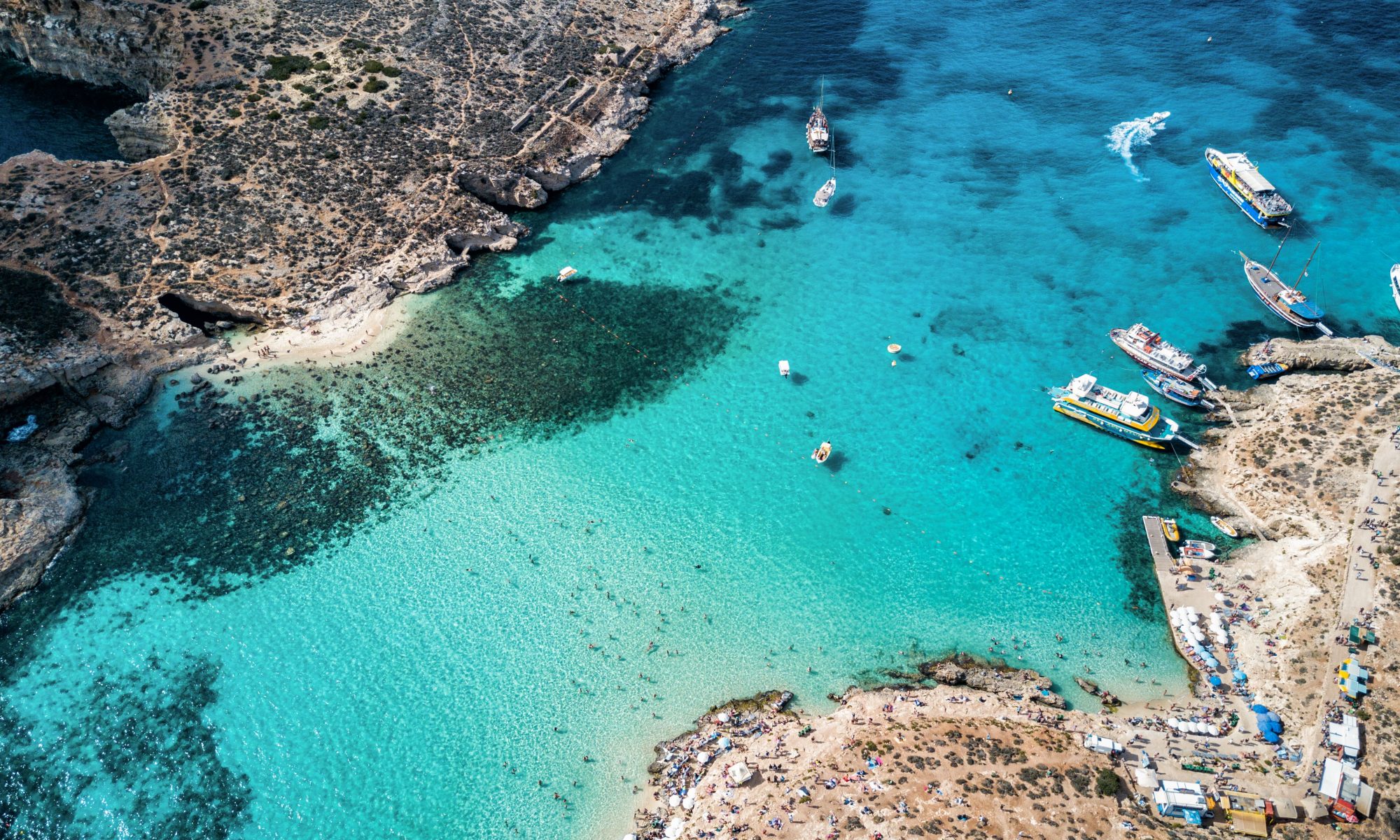 View of the Blue Lagoon in Comino where boat tours providers offer boat trips during the summer.