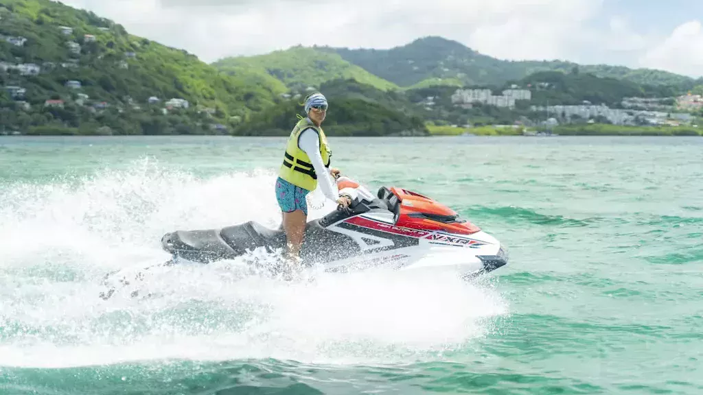 A woman riding a jetski during a tour.