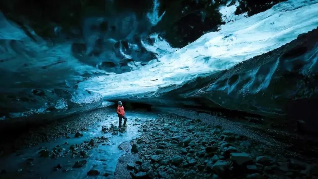 A person admiring the Sapphire Ice Cave.