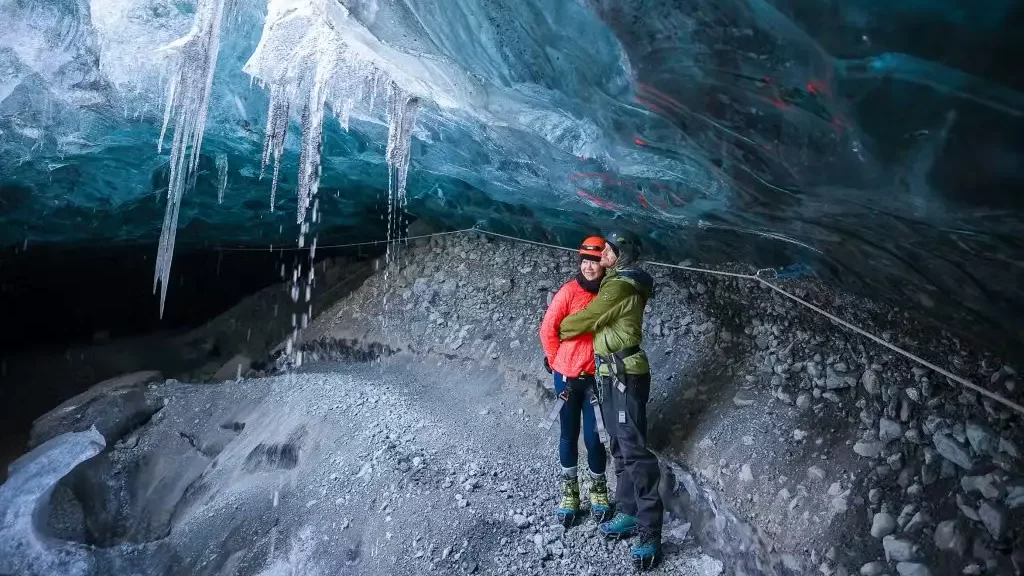 A couple admiring an Ice Cave.