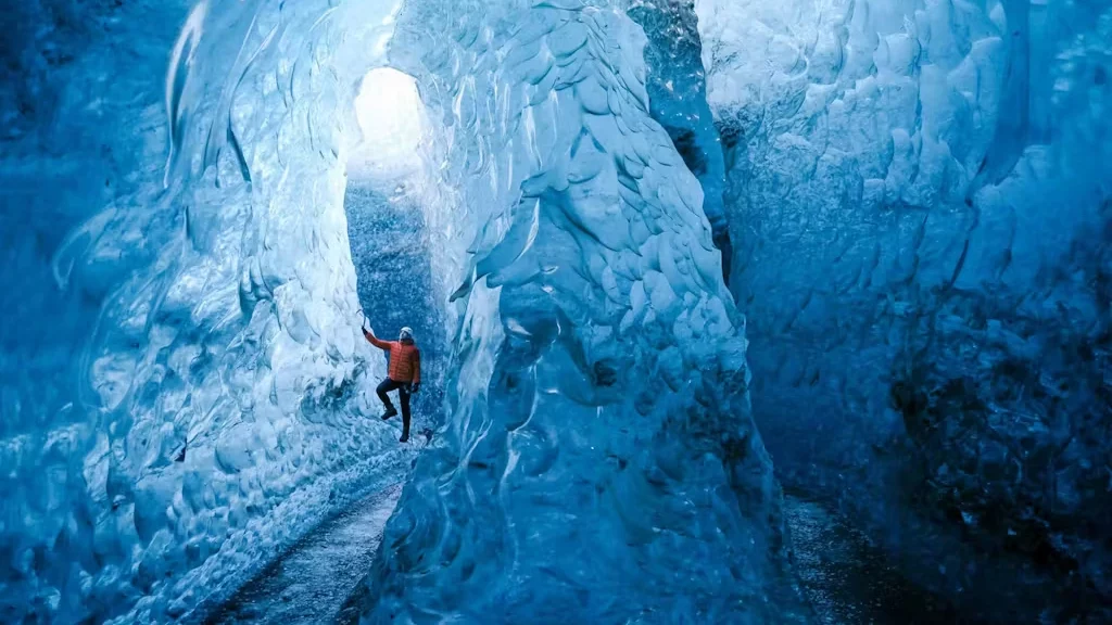 A man exploring an Ice Cave by himself