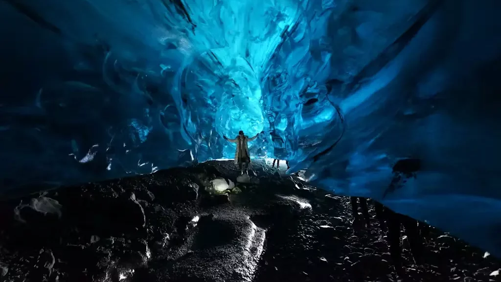 A woman exploring the Katla Ice Cave.