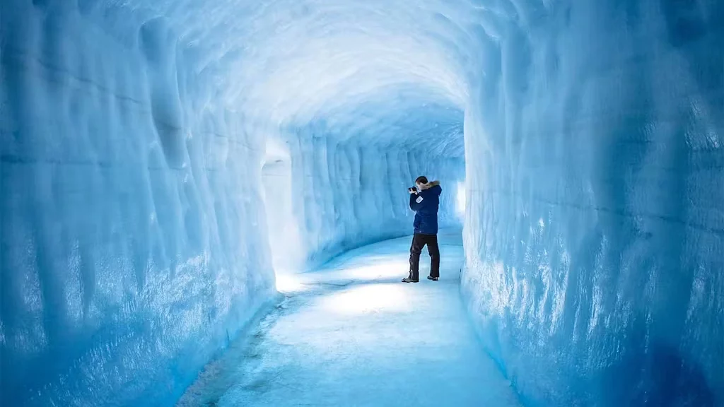 A man taking photos of the Langjökull Ice Tunnel.