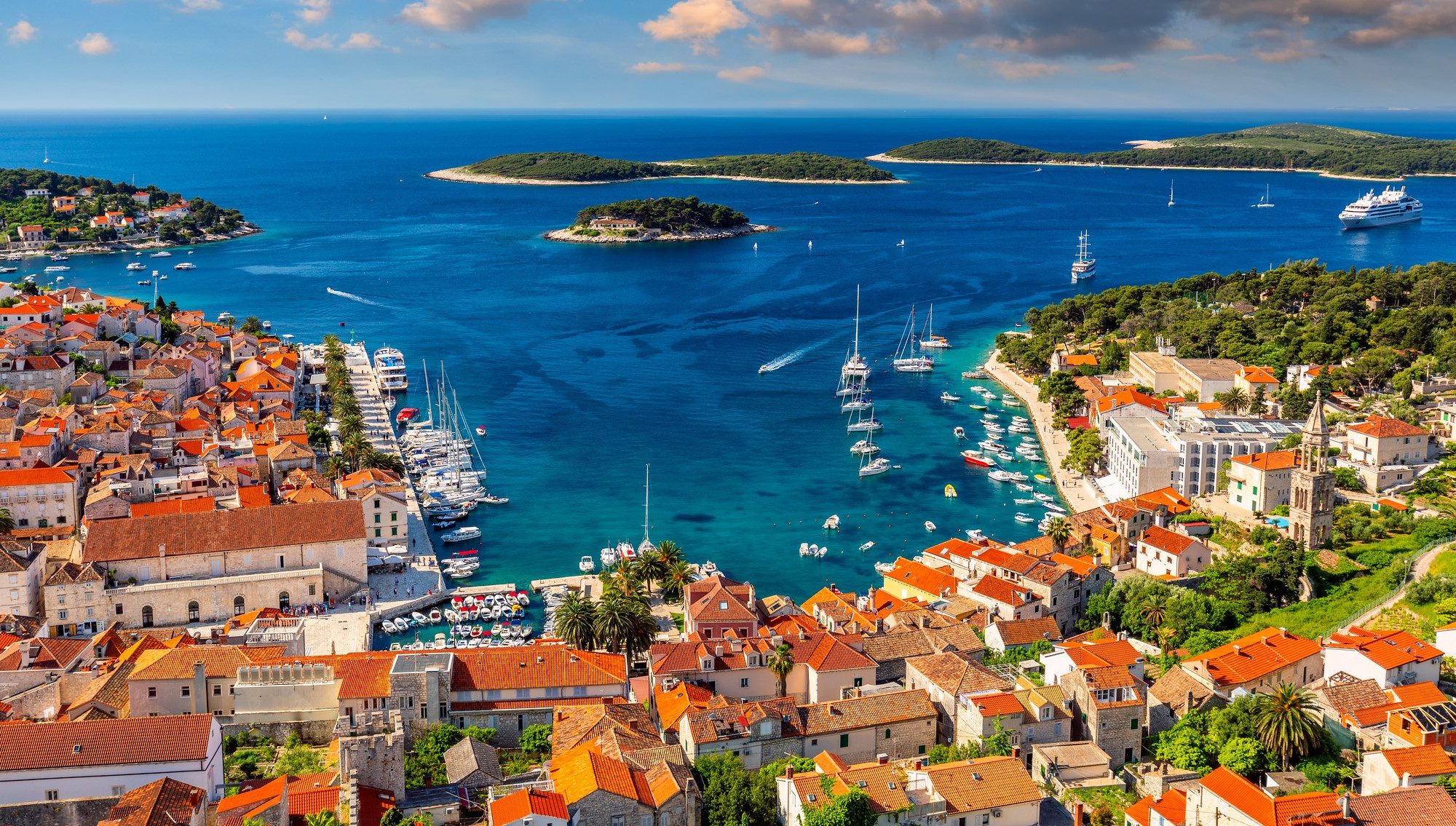 A stunning view of Dubrovnik, Croatia, showcasing its charming architecture and vibrant coastal scenery under a clear blue sky.